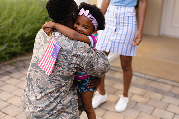 Soldier Embracing Daughter